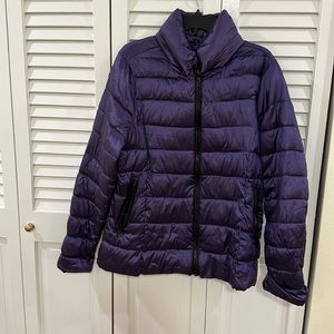 Packable winter puffer jacket with hidden hood.